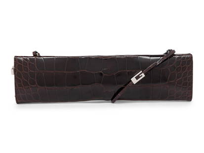 TOM FORD FOR GUCCI, DARK BROWN ALLIGATOR CLUTCH,1998: TOM FORD FOR GUCCI, DARK BROWN ALLIGATOR CLUTCH,1998 As seen on the runway from the spring/summer 1998 ready-to-wear collection by Tom Ford for Gucci. Long skinny clutch/shoulder bag in dark brown all