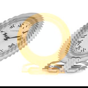 CARTIER, TRAVEL ALARM CLOCK: CARTIER, TRAVEL ALARM CLOCK Maker: Cartier Case size: Approx. 78 mm Case material: Gold-plate Dial: White Movement: Quartz Functions: Alarm Stamps: Case: Cartier Paris 0564289 GERMAN MOVEMENT - FRENCH
