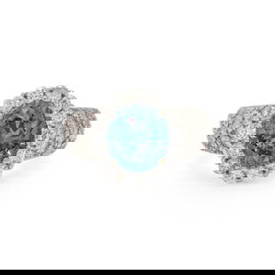 SAPPHIRE AND DIAMOND RING: SAPPHIRE AND DIAMOND RING Oval sapphire weighing approximately 5.00 carats by formula, and round diamonds weighing approximately 1.50 carats total. 14 karat white gold. Ring size 8. Stamp: 14K. Gross