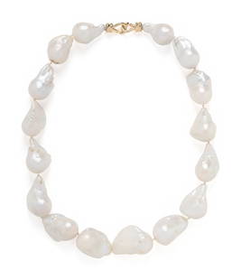 BAROQUE CULTURED PEARL NECKLACE: BAROQUE CULTURED PEARL NECKLACE Graduating baroque cultured pearls measuring approximately 25.20 x 17.00 - 31.50 x 21.50 mm, with an 18 karat yellow gold clasp. 19 inches long. Stamp: 18K. Gross weigh