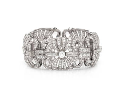 PLATINUM AND DIAMOND BRACELET: PLATINUM AND DIAMOND BRACELET Round, single, and baguette cut diamonds weighing approximately 16.00 - 18.00 carats total. Platinum. 7 inches long, 1 1/8 inch wide. Gross weight: 55.30 dwt. This lot is
