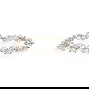 VAN CLEEF & ARPELS, DIAMOND VINE BRACELET: VAN CLEEF & ARPELS, DIAMOND VINE BRACELET Round and transitional cut diamonds weighing approximately 1.45 carats total, and rose cut diamonds, accompanied by a bracelet extender containing round a