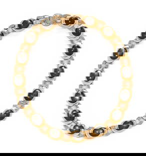 BLACK STAR SAPPHIRE, DIAMOND, AND YELLOW GOLD NECKLACE: BLACK STAR SAPPHIRE, DIAMOND, AND YELLOW GOLD NECKLACE Oval cabochon black star sapphires measuring approximately 12.50 x 10.75 mm and round brown diamonds (origin of color not tested) weighing approx