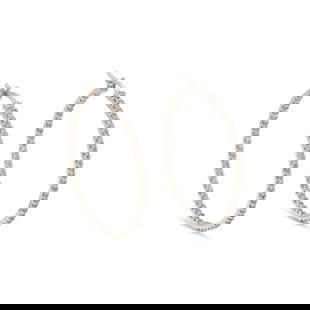 GOLD AND DIAMOND HOOP EARRINGS: GOLD AND DIAMOND HOOP EARRINGS Round diamonds weighing approximately 2.05 carats total. 18 karat white gold. 1 1/2 inches long. Stamp: D205 18K. Gross weight: 5.65 dwt. This lot is located in Chicago.