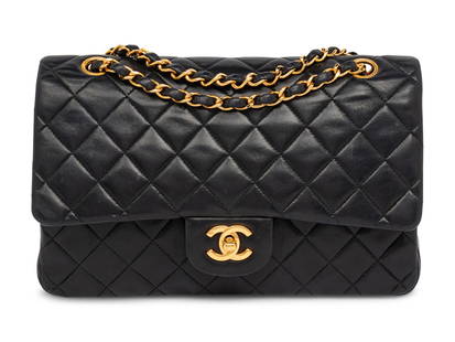 CHANEL, MEDIUM CLASSIC FLAP BAG: CHANEL, MEDIUM CLASSIC FLAP BAG Chanel medium classic double-flap shoulder bag in quilted black lambskin leather with 24k gold-plated hardware. CC turn-lock closure and interwoven leather-metal chain.