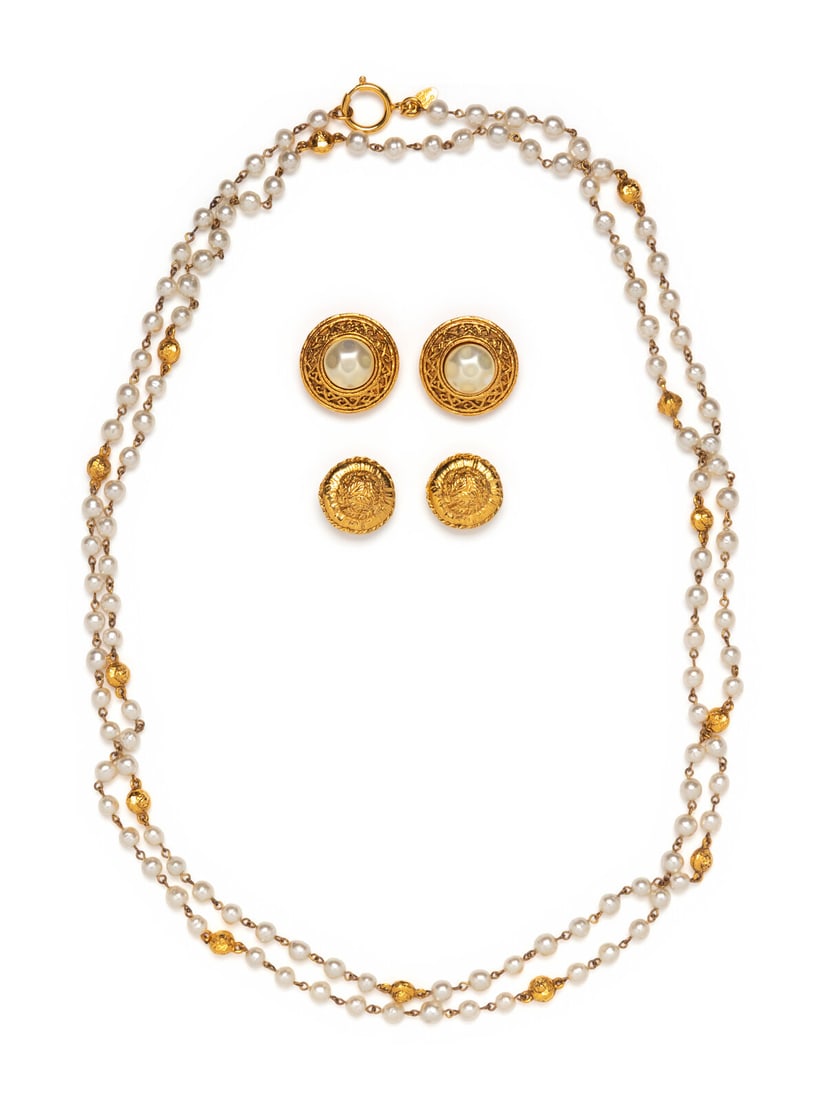 CHANEL, SAUTOIR AND TWO EAR CLIPS: CHANEL, SAUTOIR AND TWO EAR CLIPS THE FIRST Sautoir in gold-tone hammered metal and faux-pearl beads. Circular clasp closure. Stamped 'CHANEL'. Label: Chanel Date: 1970's-1980's Country of Origin: Fra