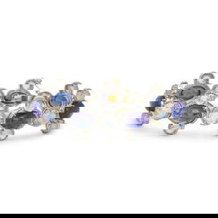 TANZANITE, MOONSTONE, AND DIAMOND BRACELET: TANZANITE, MOONSTONE, AND DIAMOND BRACELET Oval cabochon tanzanite, round cabochon moonstone, and round and single cut diamonds weighing approximately 2.75 carats total. Silver and yellow gold. 7 inch