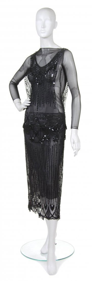 Anna Sui, (American, b. 1964), Cocktail Dress: Anna Sui (American, b. 1964) Cocktail Dress black sequins on black tulle with long sleeve black tulle underlay size 8.