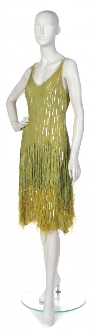 Tomasz Starzewski, (Polish/British, b. 1961), Evening D: Tomasz Starzewski (Polish/British, b. 1961) Evening Dress chartreuse silk and sequins with feathers size 6.