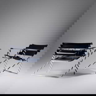 After Marcel Breuer
Late 20th Century
Pair of Lounge Chairs: After Marcel Breuer Late 20th Century Pair of Lounge Chairs chrome-plated steel, upholstery H 27 3/4 x W 31 x D 22 inches. This lot is located in Chicago. Size H 27 3/4 x