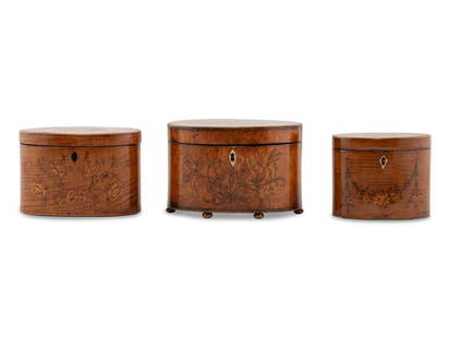 A Group of Three George III Marquetry Tea Caddies: A Group of Three George III Marquetry Tea Caddies Second Half 18th Cenury each of oval form, the front and lit of body decorated with marquetry floral sprays, the largest example raised on bun feet an