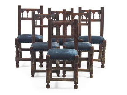A set of Six Spanish Baroque Carved Walnut and Upholstered Side Chairs: A set of Six Spanish Baroque Carved Walnut and Upholstered Side Chairs 17th or 18th Century with straight backs having carved spindles to crest-rail, on turned legs connected by stretchers, upholstere