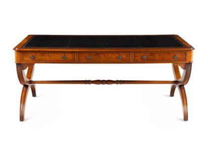 A Regency Style Burl Walnut Writing Desk: A Regency Style Burl Walnut Writing Desk 20th Century Height 31 x width 71 x depth 38 inches. This lot is located in Chicago.