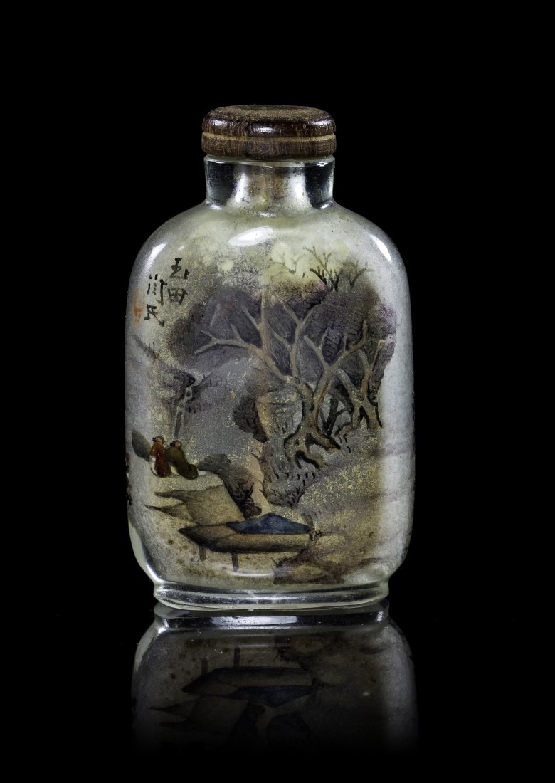 A Chinese Interior Painted Glass Snuff Bottle, Height 2: A Chinese Interior Painted Glass Snuff Bottle, of compressed flask form depicting figures in a wooded landscape, signed with a seal. Height 2 3/8 inches. Property from the Collection of John C. Meyer,
