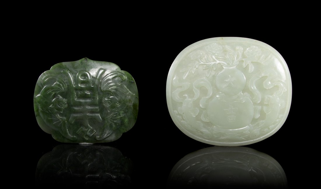 A Group of Two Jade Plaques from a Ruyi Scepter, Width : A Group of Two Jade Plaques from a Ruyi Scepter, one of a pale celadon stone centered with a double gourd carved in relief, the other of a spinach green with relief carved shou flanked by bats. Width 