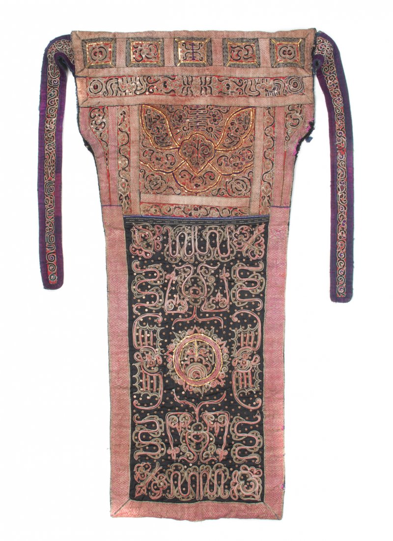 A Chinese Embroidered Baby Carrier with Metallic Thread: A Chinese Embroidered Baby Carrier with Metallic Threads, having two straps for fastening above the rectangular panel, with gilt thread accents and sequins. Height 41 x width 66 inches.