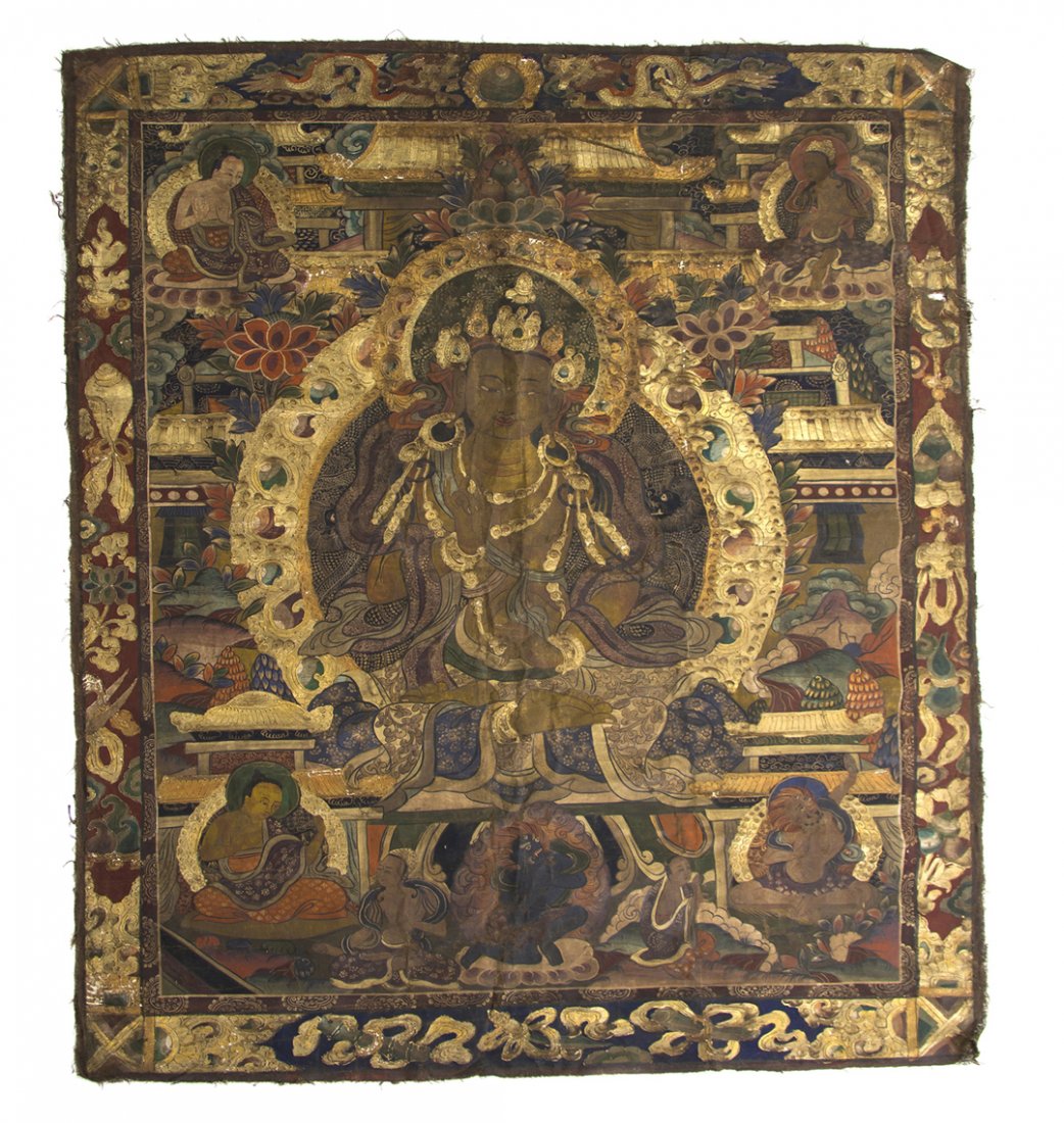 A Tibetan Thangka, Height overall 56 3/4 x width 46 1/4: A Tibetan Thangka, having polychrome pigments and gilt decoration throughout, depicting a central deity seated amongst other figures of deities and lotus blossoms, within a border of Buddhist emblems 