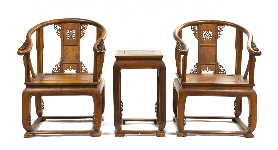 A Pair of Huanghuali Horseshoe-Back Armchairs, Height 3: A Pair of Huanghuali Horseshoe-Back Armchairs, together with a tea table, each carved with pierced spandrels. Height 36 5/8 inches.