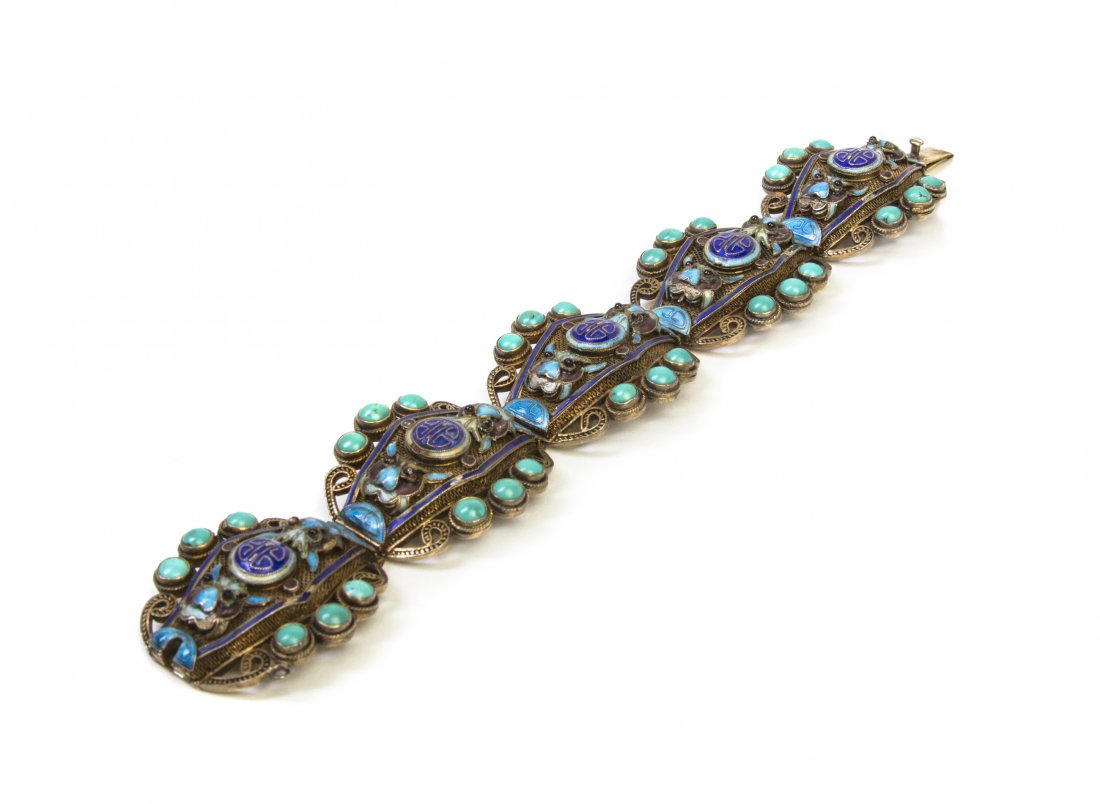 A Chinese Silver Wirework and Enamel Bracelet, Length 7: A Chinese Silver Wirework and Enamel Bracelet, having five linked sections inset with round turquoise beads, the lozenge form centers having enameled decoration depicting bats and shou medallions, the
