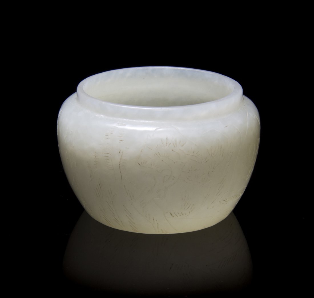 A Chinese Carved Jade Diminutive Pot, Width at widest 2: A Chinese Carved Jade Diminutive Pot, of near-white stone and of squat form, with incised Qianlong mark to the underside. Width at widest 2 1/8 inches.