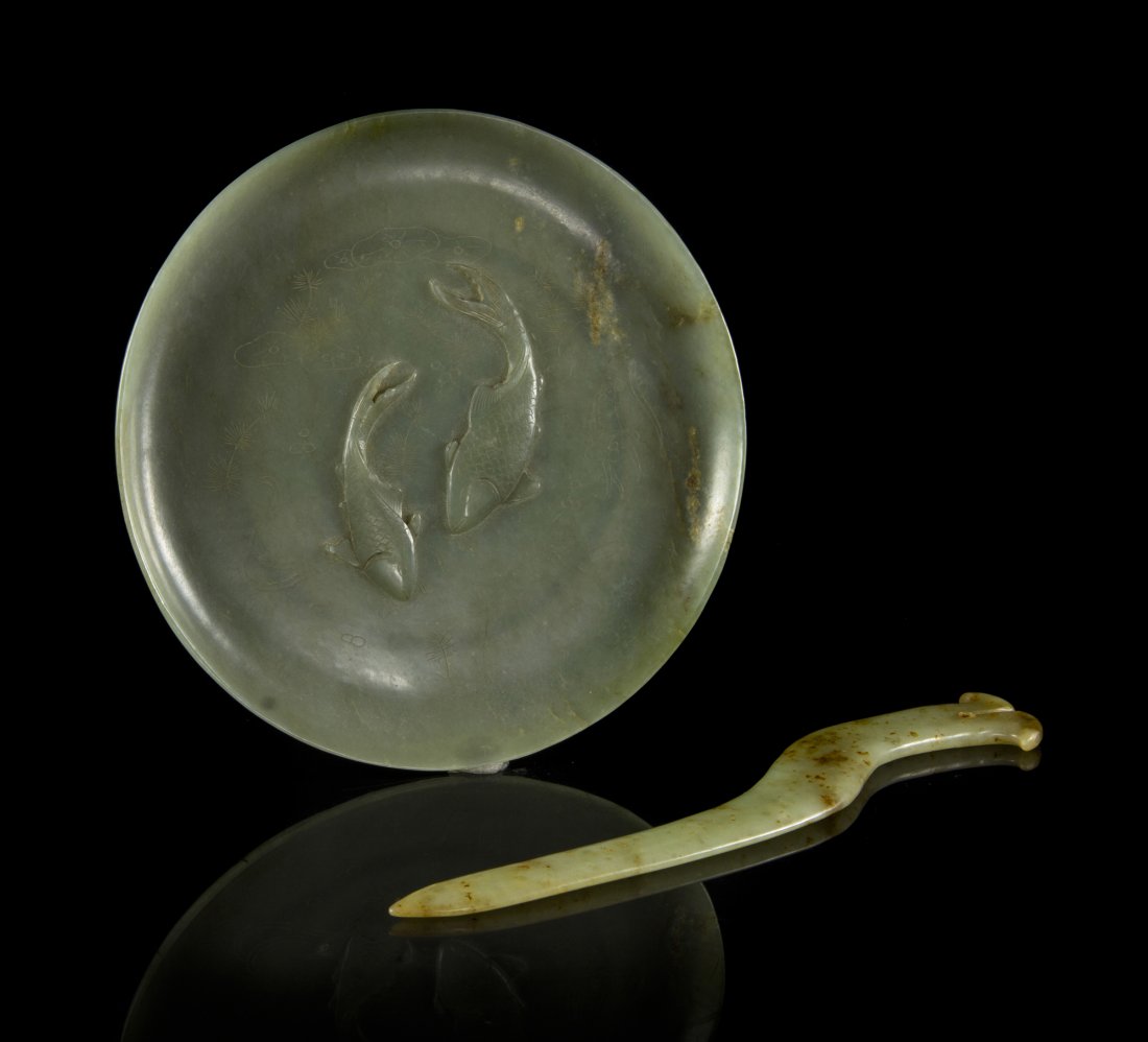 A Celadon Hardstone Plate with a Celadon Jade Blade, Le: A Celadon Hardstone Plate with a Celadon Jade Blade, the plate of circular form centered with two fishes, the blade of archaistic form. Length of blade 9 1/8 inches. Property from the Estate of Stanle