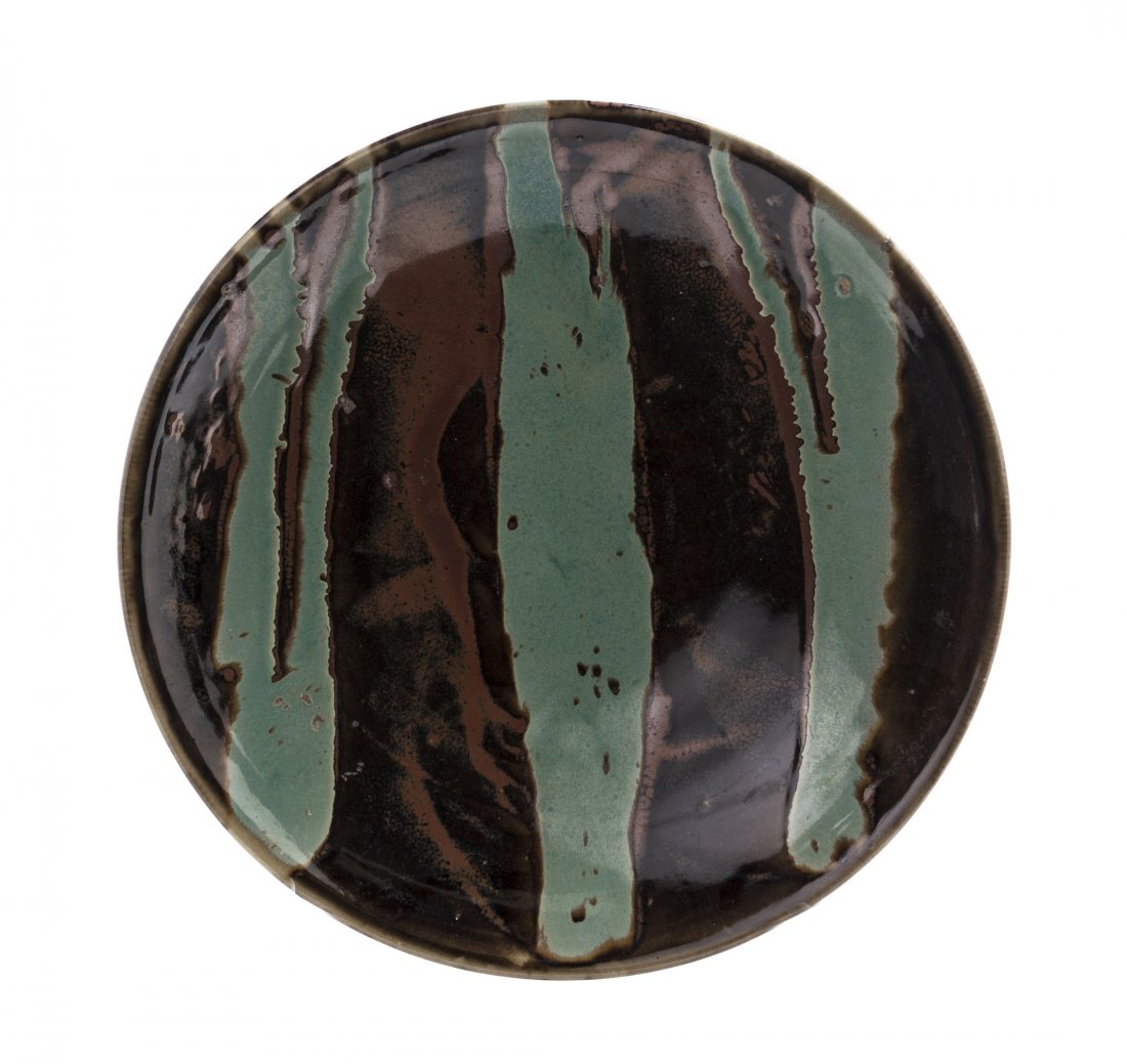 A Japanese Ceramic Charger, Attributed to Shoji Hamada,: A Japanese Ceramic Charger, Attributed to Shoji Hamada, having a mint green glaze decoration on a brown ground. Diameter 18 3/4 inches.