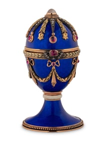 A 14 Karat Vari-Color Gold, Guilloché Enamel, Diamond, and Cabochon Jewel-Mounted Egg-Form
