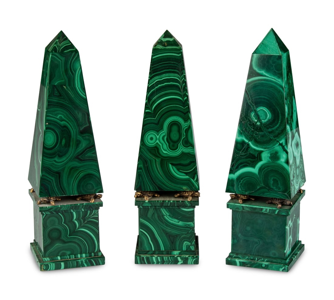 A Set of Three Malachite Obelisks: A Set of Three Malachite Obelisks 20th Century Height 10 x width 2 3/4 x depth 2 3/4 inches. Property from the Collection of Mr. John Poquette, Chicago, Illinois
