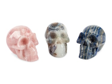 A Set of Three Carved Semi-Precious Stone Skulls