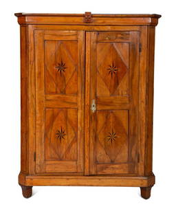 A Continental Olivewood Armoire: A Continental Olivewood Armoire 19th Century the doors detached, lacking hardware for installation.Height 73 x width 57 x depth 22 inches. Property from the Collection of Ms.