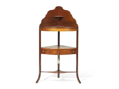 A Late Federal Banded Mahogany Corner Washstand: A Late Federal Banded Mahogany Corner Washstand Mid-Atlantic States, Circa 1820 the top with later removable mahogany surface, which fits over surface with cut holes for wash bowls. Height 44 1/2 i