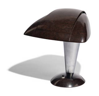 Walter Dorwin Teague (American, 1883-1960) Polaroid desk lamp 114: Walter Dorwin Teague (American, 1883-1960) Polaroid desk lamp 114 bakelite, metal manufacturer label to underside 12 3/4 h x 11 1/2 w x 9 3/4 d inches. This lot is located in Chicago.