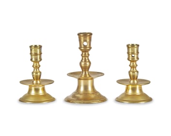 A Group of Three Dutch Brass Candlesticks