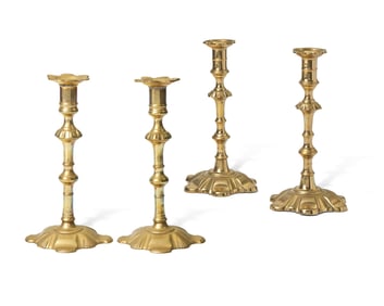 A Group of Four George III Brass Candlesticks