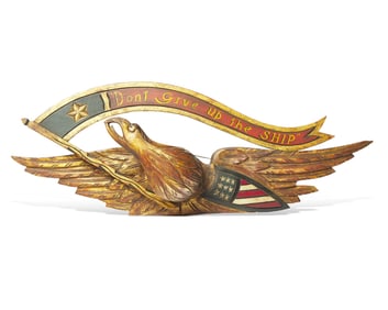 A Carved and Painted Giltwood Eagle