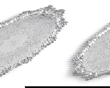 A George III Sterling Silver Salver: A George III Sterling Silver Salver Richard Palmer I, London, 1762 engraved with foliate motifs and central crest in the form of a bird of prey, the underside marked in red with old accession numbers,