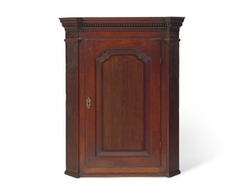 A George III Carved Oak Hanging Corner Cupboard