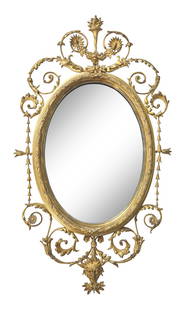 An Oval Giltwood Looking Glass: An Oval Giltwood Looking Glass Late 18th / Early 19th Century 40 x 23 inches. This lot is located in Philadelphia. Provenance: Property from the Collection of Charlene Crosby, Brielle, New Jersey.