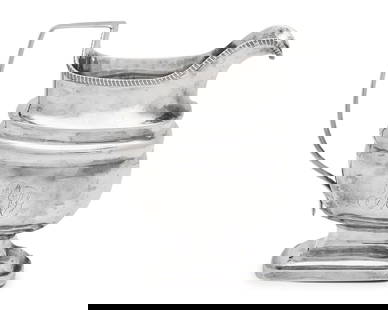 A Federal Silver Creamer: A Federal Silver Creamer Circa 1805 engraved with monogram, "PMF", apparently unmarked. Height 5 1/4 inches, Weight: 7.475 oz. t. This lot is located in Philadelphia.