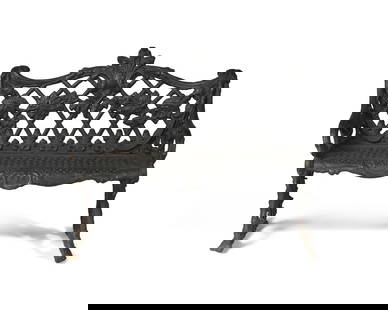 A Cast Iron Garden Bench: A Cast Iron Garden Bench John F. Riley Ironworks, Charleston, South Carolina, Circa 1870 latticework back with grapevine. Height 32 x width 40 x depth 20 1/2 inches. This lot is located in Philadelphi