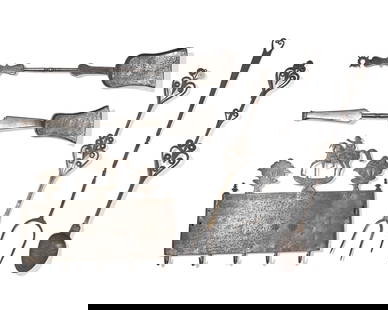 An Assorted Group of Six Wrought Iron Kitchen and Fireplace Accessories: An Assorted Group of Six Wrought Iron Kitchen and Fireplace Accessories Most French or Flemish, 18th and Early 19th Century comprising a sheet metal wall rack, with applied cast elements including a h