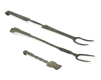A Group of Three Steel or Wrought Iron Kitchen Implements