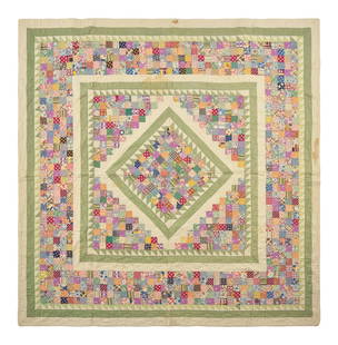 A "Postage Stamp" Pieced Quilt: A "Postage Stamp" Pieced Quilt Circa 1940 worked with solid and printed cotton patches, handsewn. 72 x 70 inches. This lot is located in Philadelphia. Provenance: Zaricor Quilt Collection.