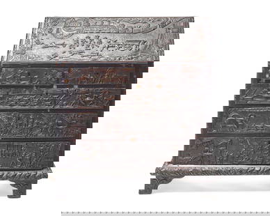 An English Relief-Carved Oak Slant-Front Desk: An English Relief-Carved Oak Slant-Front Desk First Half 19th Century the back with old label inscribed in ink, "Given to Mary in 1957." Height 43 x width 41 x depth 22 1/2 inches. This lot is located