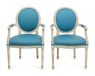 A Pair of Louis XVI Style White-Painted Medallion-Back Fauteuils: A Pair of Louis XVI Style White-Painted Medallion-Back Fauteuils 20th Century the seats upholstered in a sky-blue fabric. Height 39 x width of seat 24 inches. This lot i