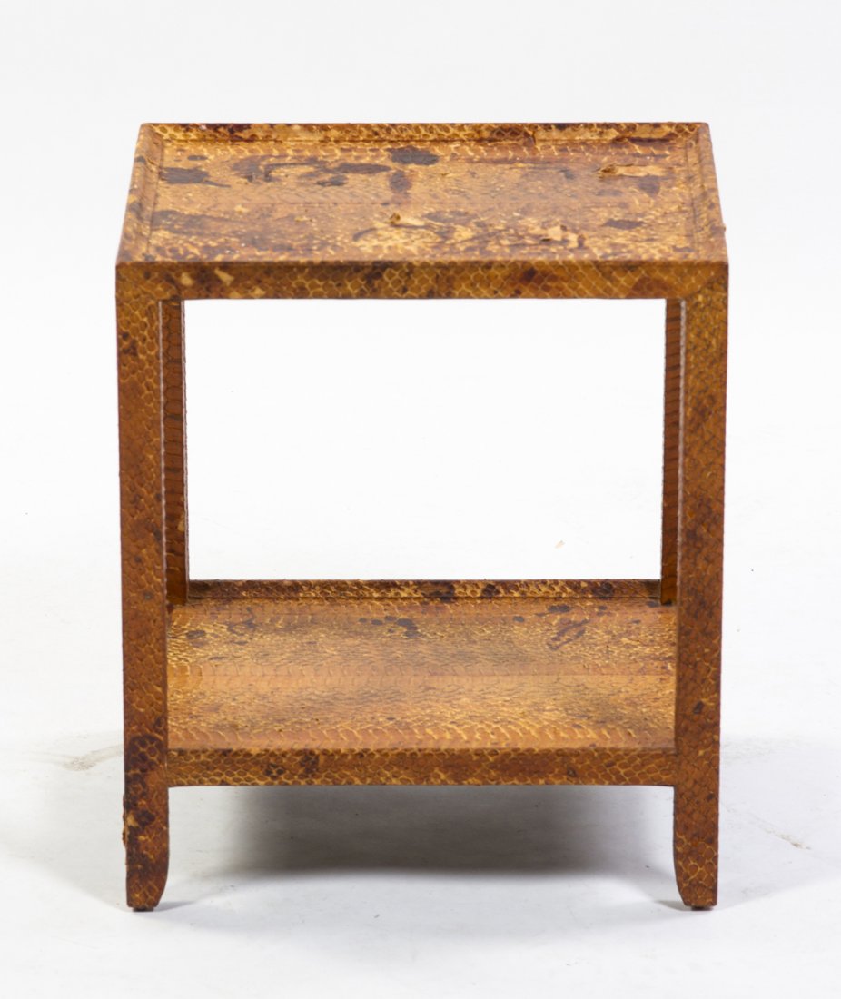 A Python Veneered Occasional Table, in the manner of Ka: A Python Veneered Occasional Table, in the manner of Karl Springer, having a rectangular top over square tapering legs joined by a medial shelf. Height 16 x width 14 x depth 12 inches.