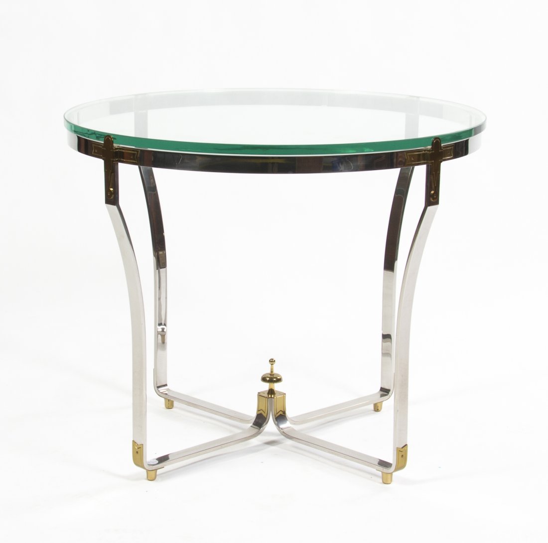 A Chromed Steel and Brass Occasional Table, Height 27 1: A Chromed Steel and Brass Occasional Table, having a circular brass top set in a strapwork frame, centered with a baluster form finial. Height 27 1/4 x diameter 32 3/4 inches.
