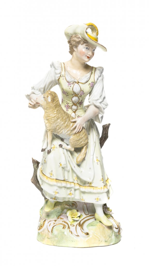 A German Porcelain Figure, Carl Thieme (1816-1888), Hei: A German Porcelain Figure, Carl Thieme (1816-1888), depicting a maiden in 18th century attire with a lamb, marked with crossed lines and a T in underglaze blue, impressed 1470. Height 9 7/8 inches. Pr