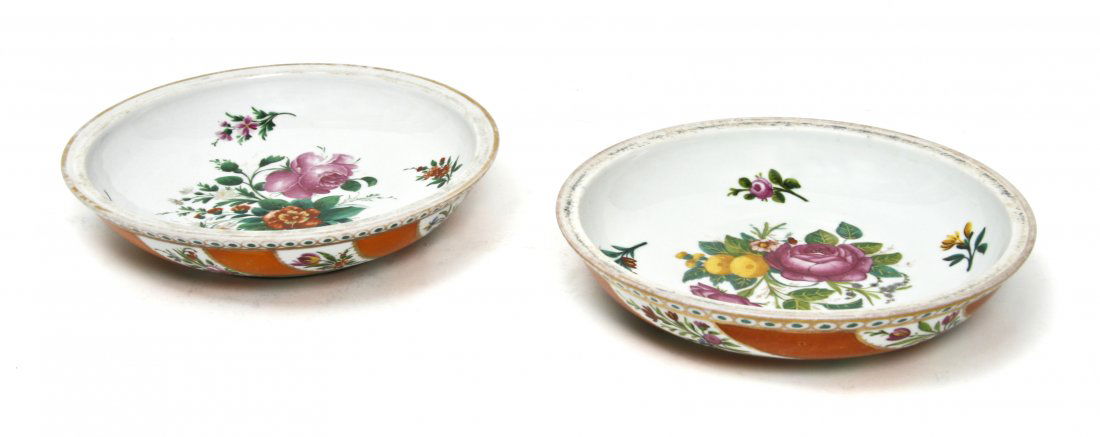 A Pair of Meissen Porcelain Dishes, Diameter 7 1/2 inch: A Pair of Meissen Porcelain Dishes, centered with floral sprays, having gilt decorated recessed rim, the lower half with alternating foliate and orange panels, one having starred crossed swords mark.