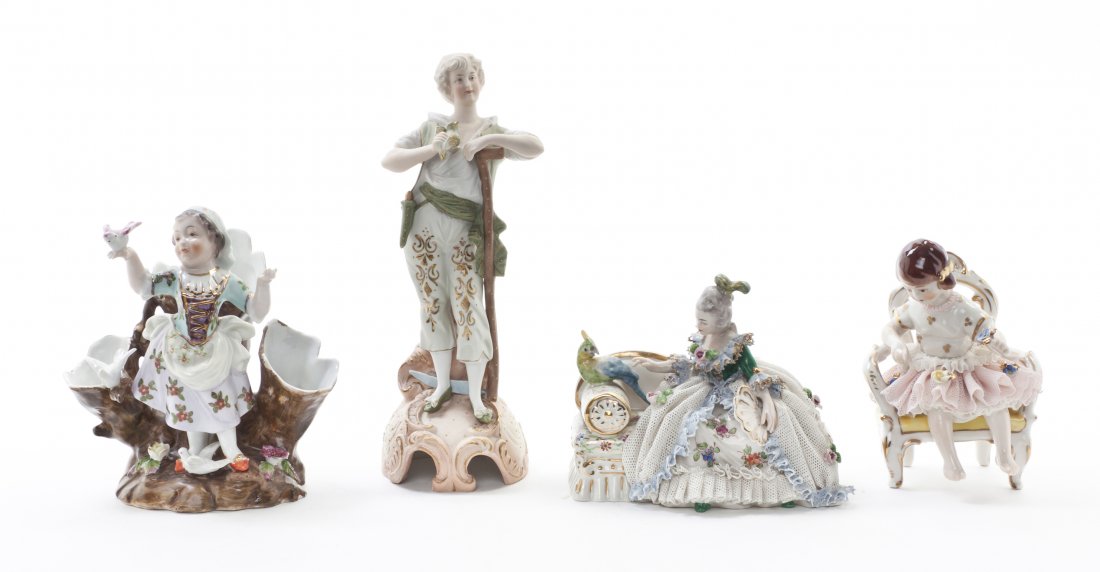 Four German Porcelain Articles, Height of tallest 8 inc: Four German Porcelain Articles, comprising a Frankenthal lace figure depicting a seated lady with a bird, an unmarked lace figure depicting a girl in a chair, a figure of a standing boy and a three-pa